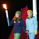 12. februar: Prinsesse Ingrid Alexandra og "idrettsgutten" - en gjennomgangsfigur i åpningsseremonien - på vei for å tenne OL-ilden. Foto: Terje Pedersen / NTB scanpix